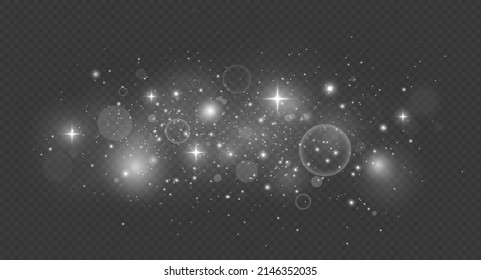 Esparcen partículas mágicas de polvo. Efecto luminoso. Las chispas de polvo y las estrellas de plata brillan con luz especial.