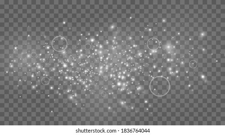 Sparkling magical dust particles. Glowing light effect with many glitter particles isolated on transparent background. Christmas abstract pattern. Vector sparkles on a transparent background.