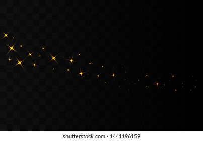 Sparks of dust and golden stars shine with a special light. Light shines on a transparent background. Christmas light effect. Glittering magic dust particles.