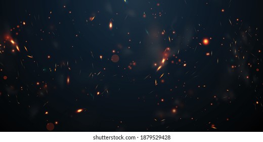 Sparks fly up Glowing particles on a black background and with flames