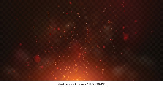 Sparks fly up Glowing particles on a black background and with flames