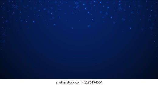Sparse glowing snow Christmas background. Subtle flying snow flakes and stars on dark blue night background. Attractive winter silver snowflake overlay template. Gorgeous vector illustration.