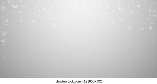 Sparse glowing snow Christmas background. Subtle flying snow flakes and stars on light grey background. Attractive winter silver snowflake overlay template. Graceful vector illustration.