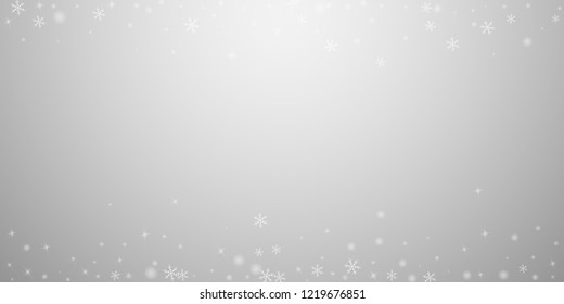 Sparse glowing snow Christmas background. Subtle flying snow flakes and stars on light grey background. Amusing winter silver snowflake overlay template. Unique vector illustration.