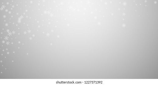 Sparse glowing snow Christmas background. Subtle flying snow flakes and stars on light grey background. Authentic winter silver snowflake overlay template. Sublime vector illustration.