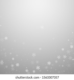 Sparse snowfall Christmas background. Subtle flying snow flakes and stars on light grey background. Admirable winter silver snowflake overlay template. Stunning vector illustration.