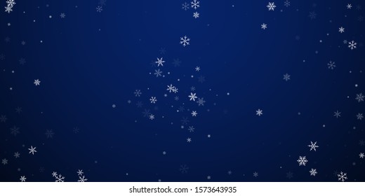 Sparse snowfall Christmas background. Subtle flying snow flakes and stars on dark blue night background. Artistic winter silver snowflake overlay template. Charming vector illustration.