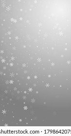 Sparse snowfall Christmas background. Subtle flying snow flakes and stars on grey background. Amusing winter silver snowflake overlay template. Noteworthy vertical illustration.