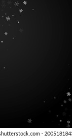 Sparse snowfall Christmas background. Subtle flying snow flakes and stars on black background. Adorable winter silver snowflake overlay template. Exquisite vertical illustration.