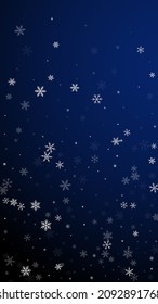 Sparse snowfall Christmas background. Subtle flying snow flakes and stars on dark blue background. Appealing winter silver snowflake overlay template. Eminent vertical illustration.