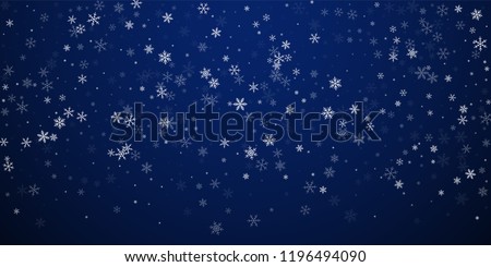 Sparse snowfall Christmas background. Subtle flying snow flakes and stars on dark blue night background. Beauteous winter silver snowflake overlay template. Symmetrical vector illustration.