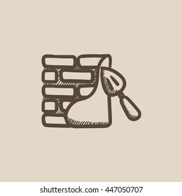 Espátula con un icono de dibujo vectorial de ladrillo aislado en el fondo. Espátula dibujada a mano con un icono de pared de ladrillo. Espátula con un icono de sketch de ladrillo para infografía, sitio web o aplicación.