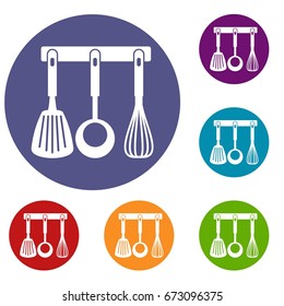 Spatula, ladle and whisk, kitchen tools on a hanger icons set in flat circle reb, blue and green color for web
