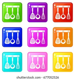 Spatula, ladle and whisk, kitchen tools on a hanger icons of 9 color set isolated vector illustration