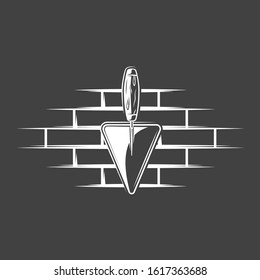 Spatulas located on a brick wall isolated on black background. Silhouette of spatulas and brick wall vector symbols. Work tools for build design