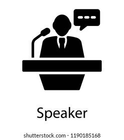 Speaker on rostrum delivering speech