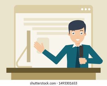 The speaker is presenting in front of the computer