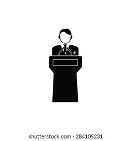  Speaker stands behind the podium