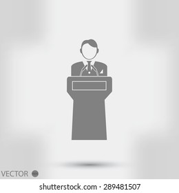  Speaker stands behind the podium