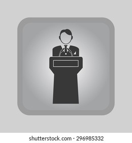  Speaker stands behind the podium