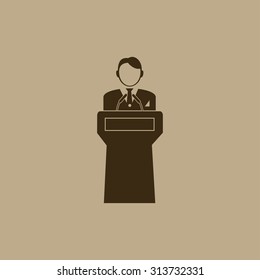  Speaker stands behind the podium
