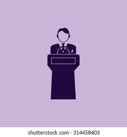  Speaker stands behind the podium
