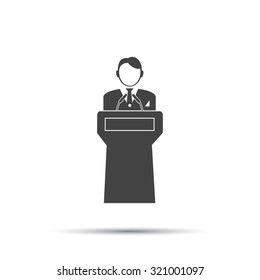  Speaker stands behind the podium