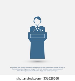  Speaker stands behind the podium