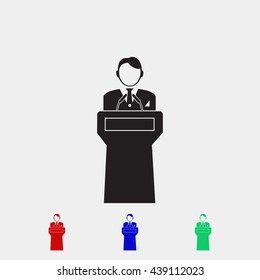  Speaker stands behind the podium