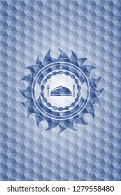 special food icon inside blue emblem with geometric pattern.