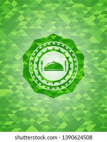 special food icon inside green emblem with mosaic ecological style background