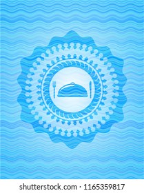 special food icon inside light blue water wave style badge.