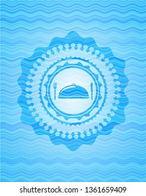 special food icon inside water wave concept style badge.