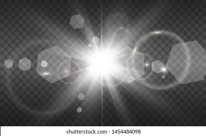 Special lens flash, light effect. The flash flashes rays and searchlight. White glowing light. Beautiful star Light from the rays. The sun is back-lit. Bright beautiful star. Sunlight. Glare.