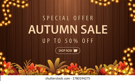 Special offer, autumn sale, up to 50% off, brown discount banner with frame of garland, autumn vegetations, wooden background and offer with button