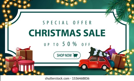 Special offer, Christmas sale, up to 50% off, green discount banner with white paper sheet in the form of vintage ticket , Christmas tree branches, garlands and red vintage car carrying Christmas tree