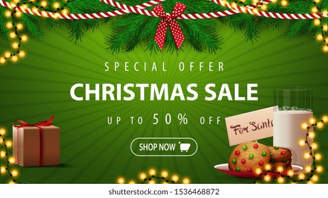 Special offer, Christmas sale, up to 50% off, beautiful green discount banner with Christmas tree branches, garlands and cookies with a glass of milk for Santa Claus