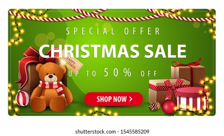 Special offer, Christmas sale, up to 50% off, horizontal green banner with button, garlands and presents with Teddy bear