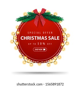 Special offer, Christmas sale, up to 50% off, round red discount banner wrapped with garland isolated on white background