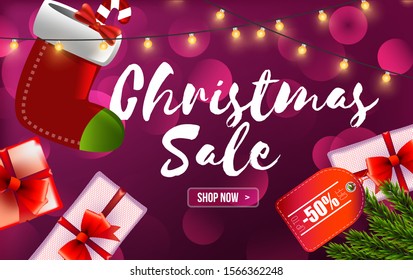 Special offer, Christmas sale, up to 50% off, red banner with garland, Christmas tree branches, Christmas stockings and gifts