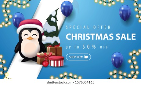 Special offer, Christmas sale, up to 50% off, blue discount banner with garland, blue balloons, diagonal line and penguin in Santa Claus hat with presents