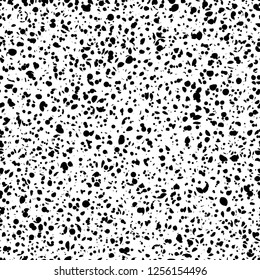 Speckled fashionable, grunge seamless pattern, animal texture, print, background. White speckled shapes on black background.