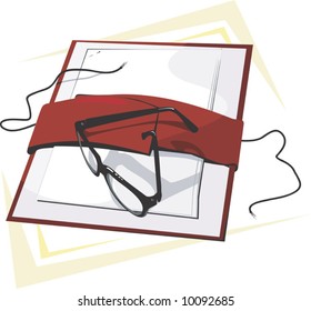  a spectacle on top of a file	
