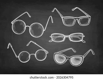 Spectacles, round glasses and sunglasses. Chalk sketch set on blackboard background. Hand drawn vector illustration. Retro style.