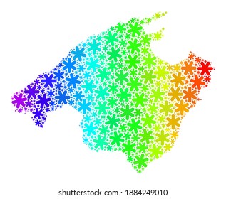 Spectral gradient mosaic of Mallorca map designed for Winter ads. Mallorca map mosaic is designed of multicolored snowflakes. Designed for Christmas posters.
