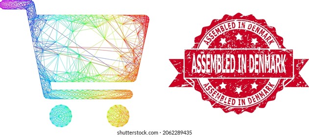 Carro de compra del marco de alambre de color espectral y sellado del sello de goma de Dinamarca. El sello rojo incluye el texto Ensamblado en Dinamarca dentro de la cinta.