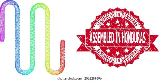 Spectrum bunten Drahtseilrohr, und Assembled in Honduras unlean Band Stempel-Dichtung. Rote Stempelsiegel enthält Assembled in Honduras Text in Band.
