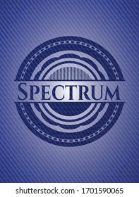 Spectrum emblem with jean background. Vector Illustration. Detailed.