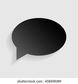 Speech bubble icon. Black paper with shadow on gray background.