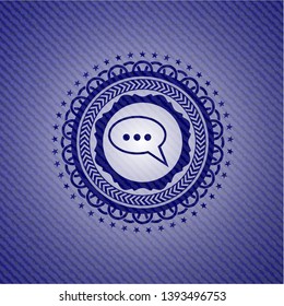 speech bubble icon inside badge with jean texture